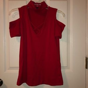 Red shirt. Size small. Neck high. Open shoulders.